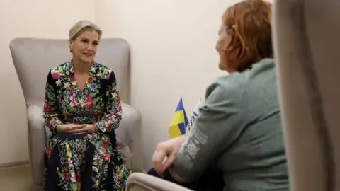 Reuters Sophie sits on an armchair, speaking to a woman with red hair whose face cannot be seen by the camera