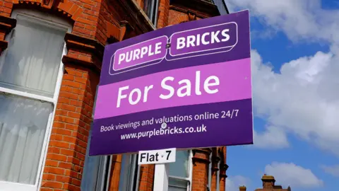 Alamy Purple Bricks sale sign