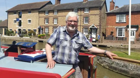 Pete Cooper/BBC Andrew Woodward, joint owner of the Boat Inn in Stoke Bruerne