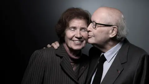 AFP Serge Klarsfeld (left) poses with his wife Beate