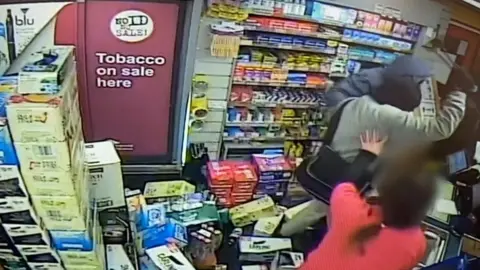 Two men who robbed a Cleethorpes convenience store with an axe have been jailed at Grimsby Crown Court for three years