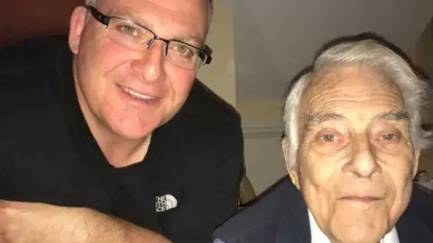 Stuart Dollery Stuart and his dad Colin