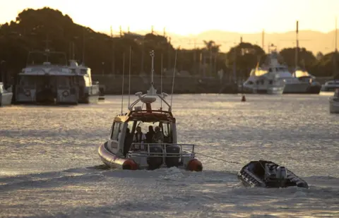 Getty Images Coastguard rescue boats are pictured alongside the marina near Whakatane