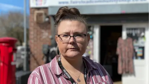 Shaun Whitmore/BBC Emma Brock outside Fairstead Community Shop in King's Lynn