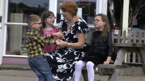 Christine Holder’s three young grandchildren Leo (4), Paige (7) and Ellie (8)