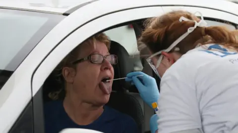 Getty Images Woman is tested for coronavirus