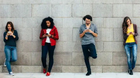 Getty Images Men and women on phones