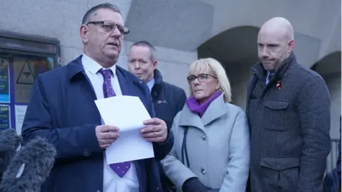 PA Media (left to right) Gary Furlong, Andrew Wails, Jan Furlong and Gary Furlong Jnr outside the Old Bailey