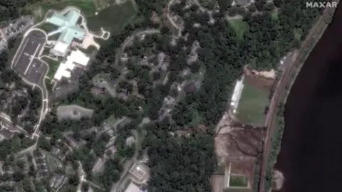 Maxar Technologies flooded athletic fields along the Hudson River after days of storms