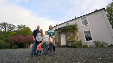 Paul Tyagi Homeowners Karen and Matt, their daughters Cora and Marnie and son, William, outside The Moss, a Georgian renovation in Killearn