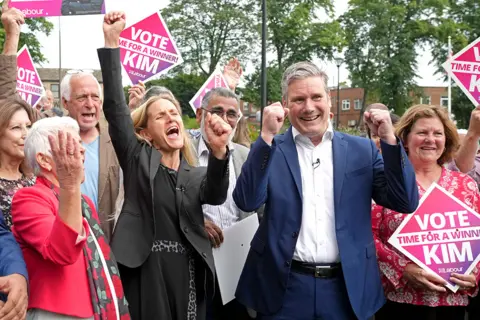 Christopher Furlong / Getty Images Kim Leadbeater celebrates her victory in the Batley and Spen by-election alongside Labour leader Sir Keir Starmer in Cleckheaton