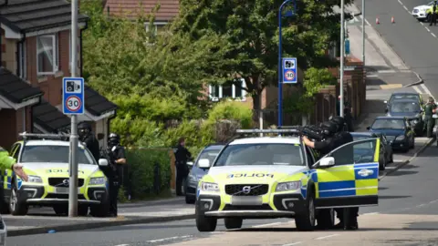 Peter Flemming Armed police at scene