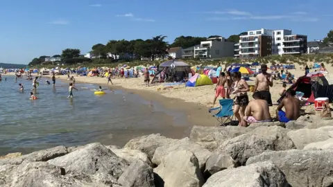 BBC Families soaked up the sun on Sandbanks beach in Poole, Dorset