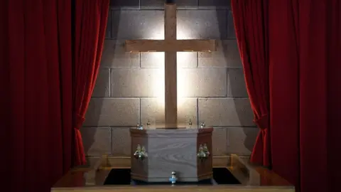 Getty Images Coffin of care worker Janet Livingston,