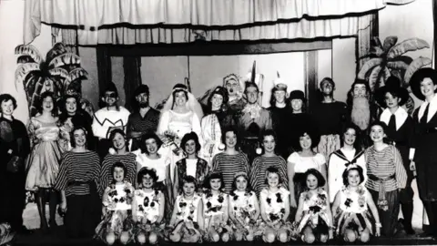 All Saints Dramatic Society All Saints Dramatic Society Panto 1963 - Mrs Eyre is on the second row, second on the left