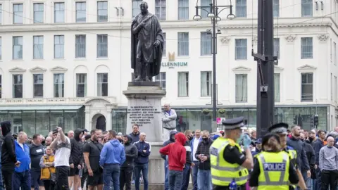 PA Media Protesters at a demonstration in George Square in Glasgow.