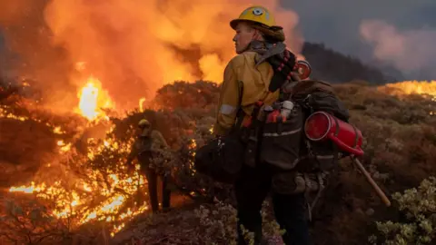 Getty Images Firefighters at the Caldor fire