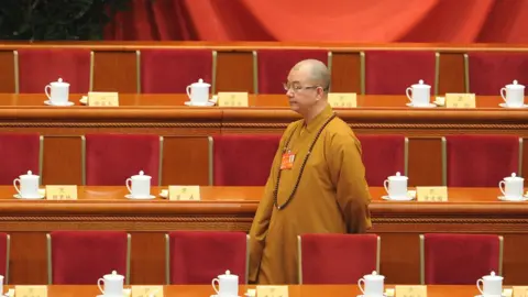 Getty Images Buddhist Master Xuecheng arrives at the opening session of the Chinese People's Political Consultative Conference , 2014