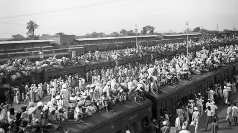 Getty Images Refugees crowd onto to trains during the partition of British India in 1947