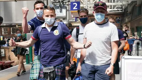 PA Media fans in Glasgow Central on Thursday