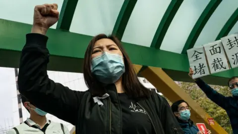 Getty Images Medical workers hold a strike near Queen Mary Hospital