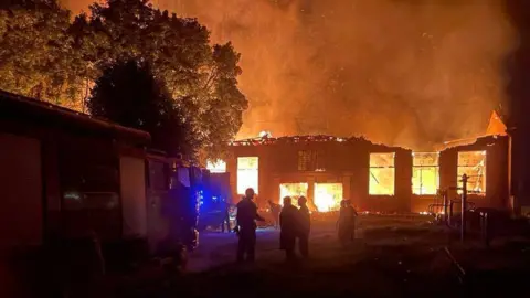 Telegram/Volodymyr Zelensky Photo purportedly showing a blood transfusion centre on fire in Kupiansk community, north-eastern Ukraine