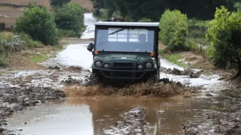 PA Media A flooded road in Grinton