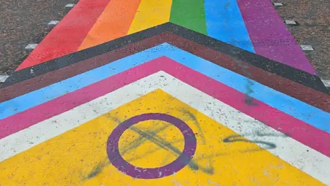 BBC Rainbow zebra crossings defaced with graffiti