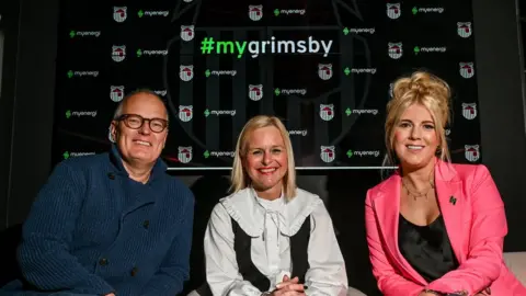 Grimsby Town Jason Stockwood, Debbie Cook and Jordan Brompton