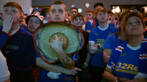 Getty Images Rangers fans watching the game