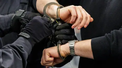 Getty Images A man being handcuffed