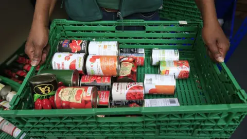 PA Media Stocks of food at a foodbank.