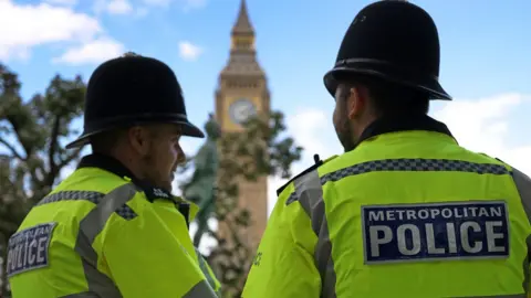 EPA Police men outside parliament in London