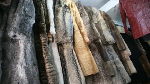 BBC Fur coats on a rack