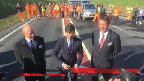 Minister Ken Skates seen cutting the ribbon