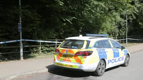 South Beds News Agency A police car parked near Fairlands Valley Park in Stevenage