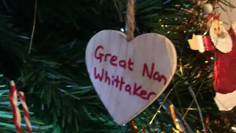 Keith Whittaker A wooden heart with Great Nan Whittaker written on it