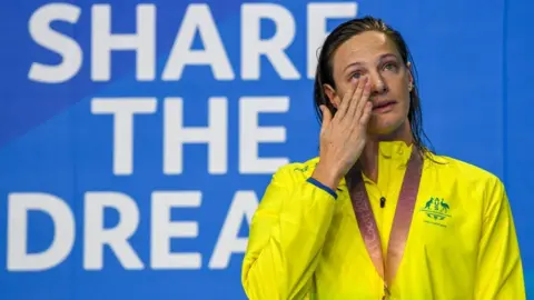 Getty Images Australia's Cate Campbell cries as she poses with her medal at the 2018 Gold Coast Commonwealth Games