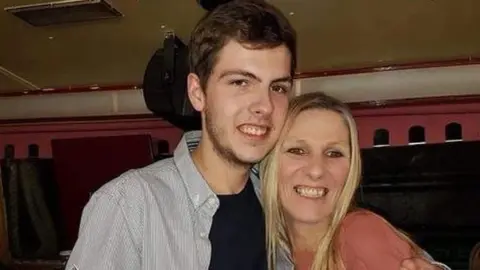 Family handout Paul Wood, with his mother Helen