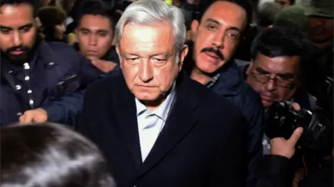 AFP Mexican President López Obrador in gaggle of press (19 January)