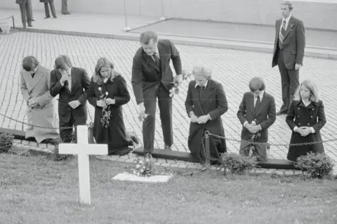 Getty Images Family gather at Robert Kennedy's grave, 11 years later