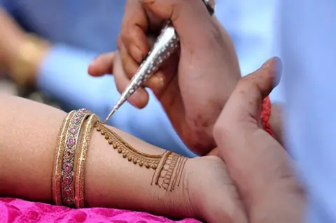 Prerna Jain Henna being put on to someone's arm