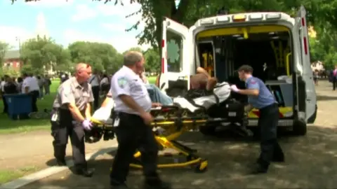 Emergency crews escort a victim to an ambulance in New Haven, Connecticut.
