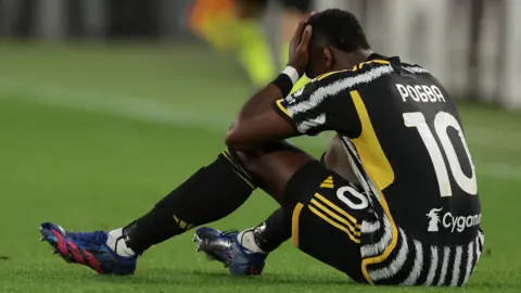Juventus midfielder Paul Pogba on the pitch injured
