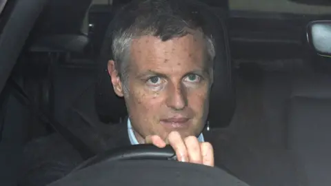 Lord Goldsmith pictured driving in 2019