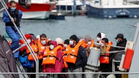 Reuters Migrants arrive at Dover