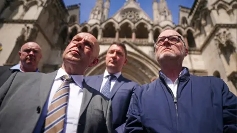 PA Media Barry McCaffrey and Trevor Birney in London