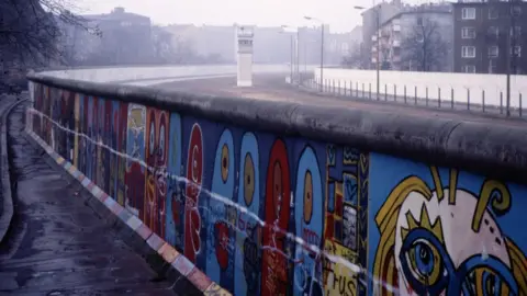 Getty Images A section of the Berlin Wall covered in graffiti