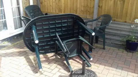 Salma Khan Overturned garden furniture