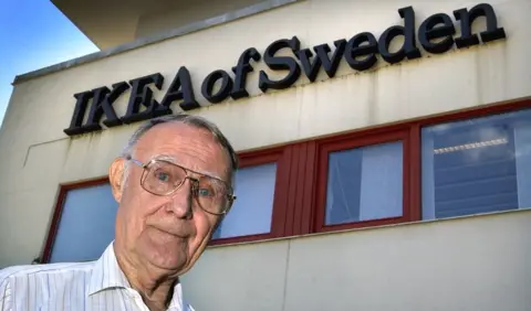 Getty Images Ikea founder Ingvar Kamprad posing outside the furniture giant's headquarters in Almhult, southern Sweden, 6 August 2002